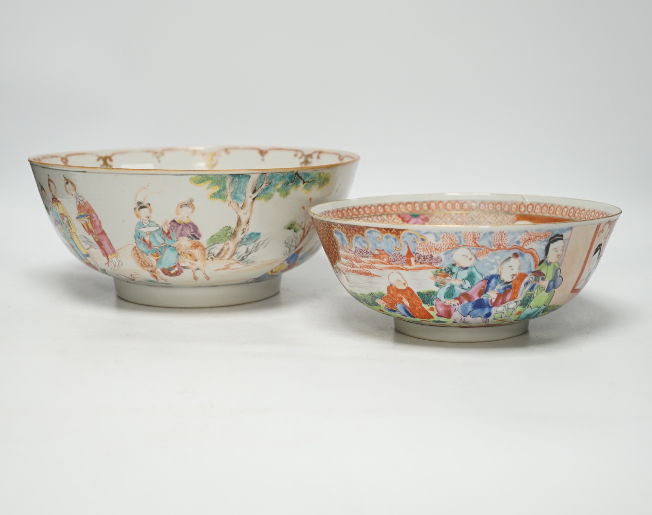 A Chinese famille rose bowl decorated with a dignitary and court figures (a.f.) and another smaller bowl, both Qianlong, largest 25cm in diameter